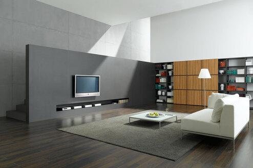 Wohnraumimpression mit Fernsehwand zur Treppe Offene Wohnraumimpression mit grauer TV-Trennwand zur Treppe und Einbauregal aus Holz und weißem Sofa